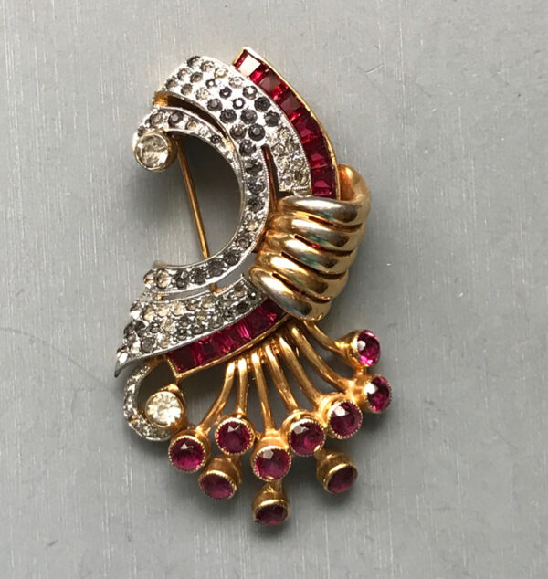 DEROSA sparkling red and clear rhinestone fur clip in a gold plated setting,1940s