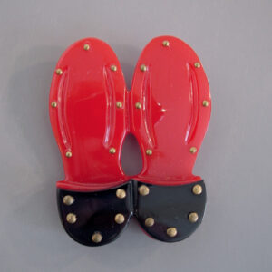 SHULTZ bakelite red and black shoe soles brooch with brass tacks