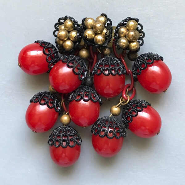 MIRIAM HASKELL by Frank Hess red bakelite acorn brooch with black enameled filigree tops, 1940s