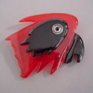 SHULTZ bakelite transparent red parrot head brooch with black face and beak